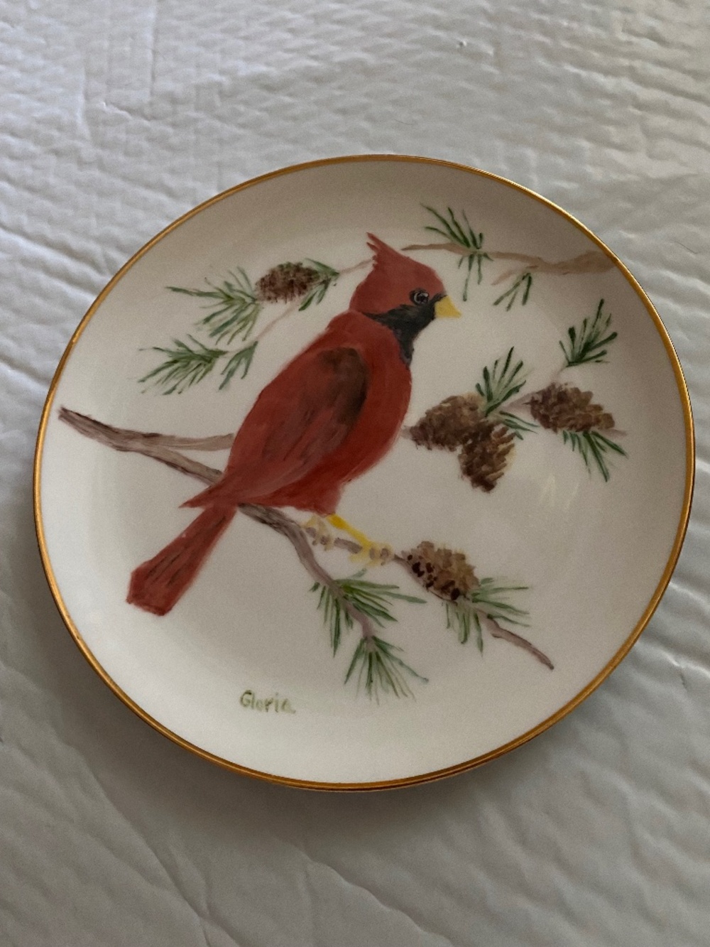 Cardinals handpainted plate, trimmed, in gold signed by Gloria.